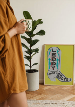Leddy boot print in chartreuse and grey by Betsy Crum, framed with a velvet mat