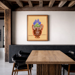Lone Star bluebonnet art print by Betsy Crum framed in a rustic room with wood beams