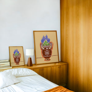 Lone Star Beer and Books Texas art print by Betsy Crum — framed in a wood-accent room
