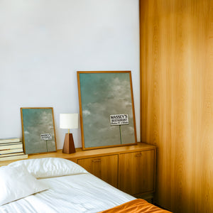 Massey's Fort Worth art print by Betsy Crum — framed in a wood-accent room