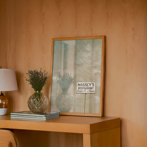 Massey's Fort Worth art print by Betsy Crum — framed in a wood-accent room