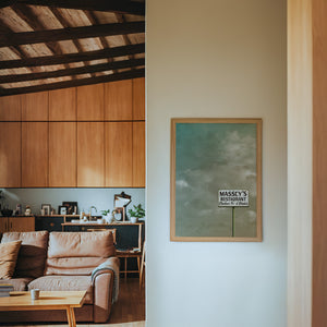 Massey's Fort Worth art print by Betsy Crum — framed in a wood-accent room
