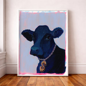 Money Cow black cow art print with gold dollar-sign charm, pink and lavender background, leaning in neutral room with hardwood floors.