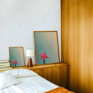 Pegasus Flying Red Horse Dallas art print by Betsy Crum — framed in a wood-accent room