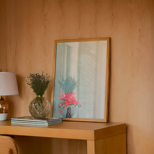 Pegasus Flying Red Horse Dallas art print by Betsy Crum — framed in a wood-accent room