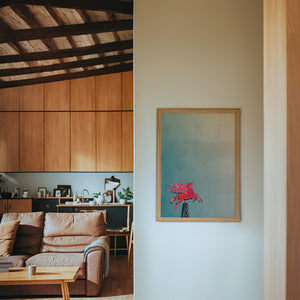 Pegasus Flying Red Horse Dallas art print by Betsy Crum — framed in a wood-accent room