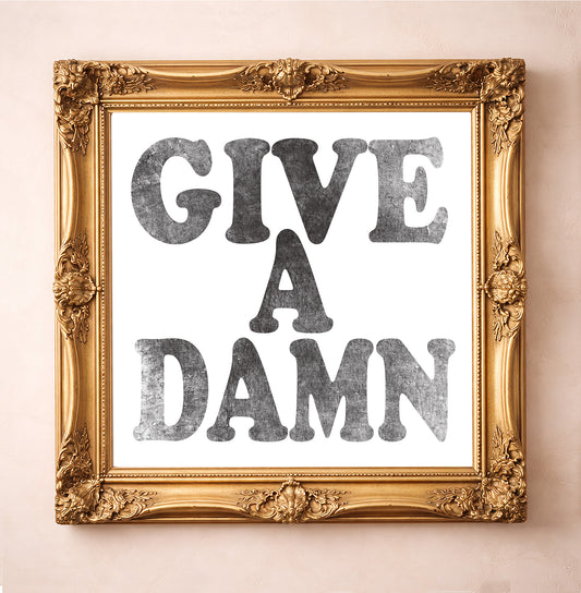 Give a Damn, Black on White — typography art print by Betsy Crum in a square gold frame