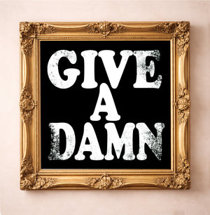 Give a Damn, White on Black — typography art print by Betsy Crum in a square gold frame