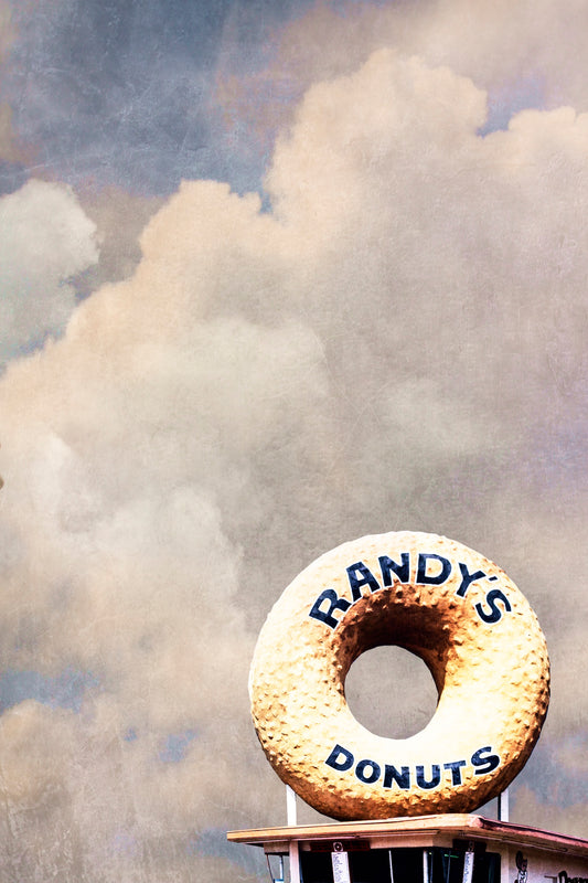 Randy's Donuts Los Angeles art print by Betsy Crum, the giant donut sign under a big cloudy sky