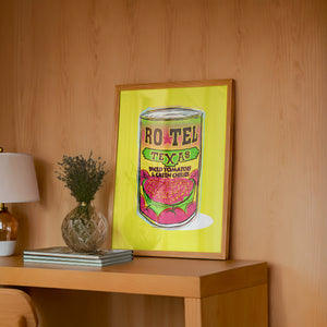 Ro-Tel Can kitchen art print by Betsy Crum — framed in a wood-accent room