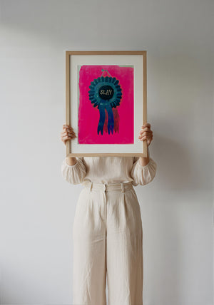 Slay Ribbon funny wall art print by Caya Crum — framed with velvet mat