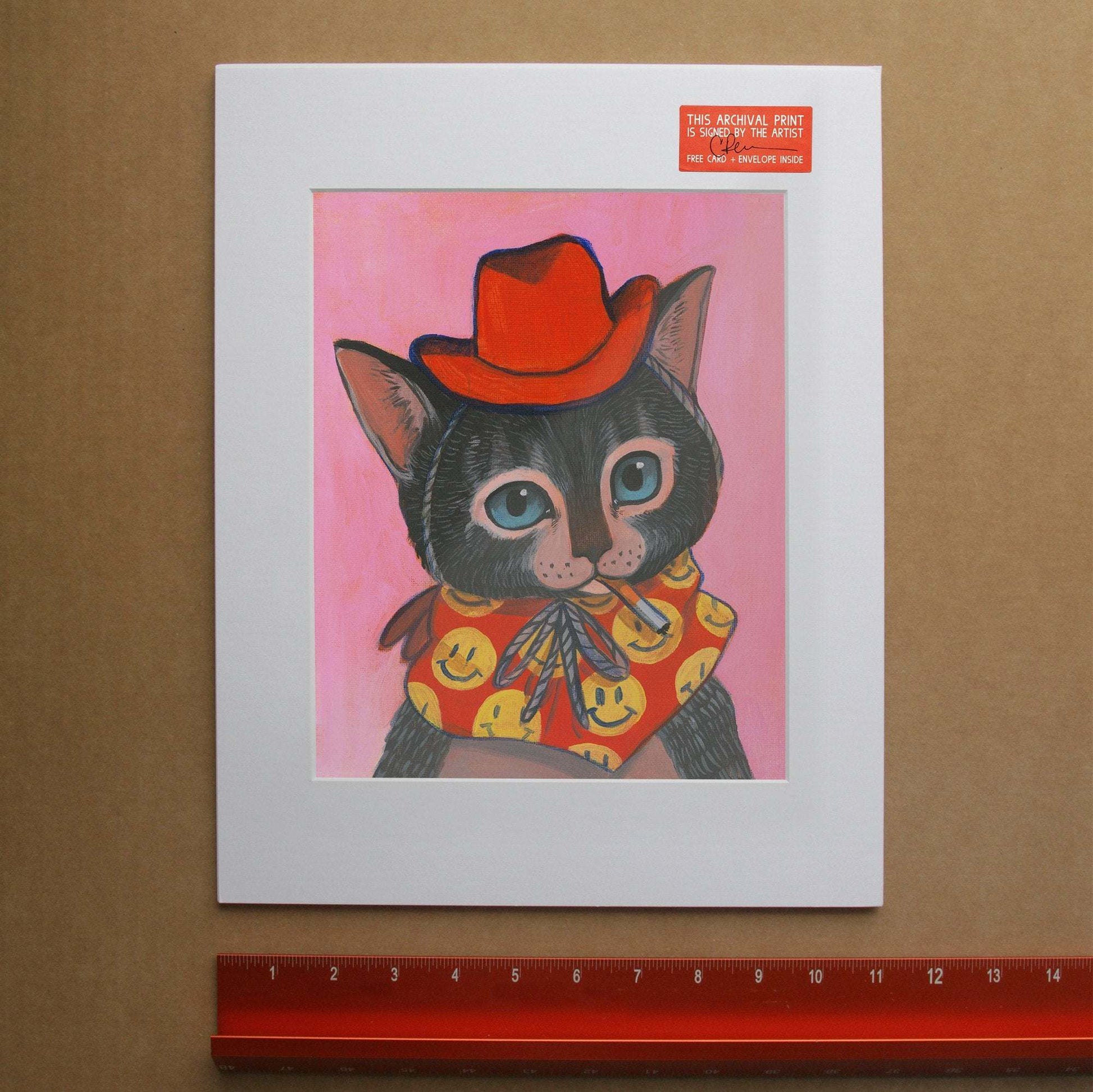 Smoking Cat  cowboy kitten art print with red hat and smiley face bandana on pink background