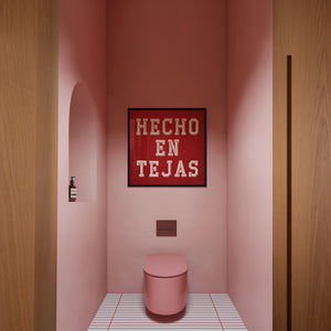Hecho en Tejas typography art print by Carl Crum framed in a room