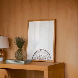 Texas Star Ferris Wheel Texas art print by Betsy Crum — framed in a wood-accent room