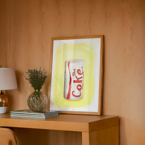 Diet Coke Painting diet coke art print by Tavi Crum — framed in a wood-accent room