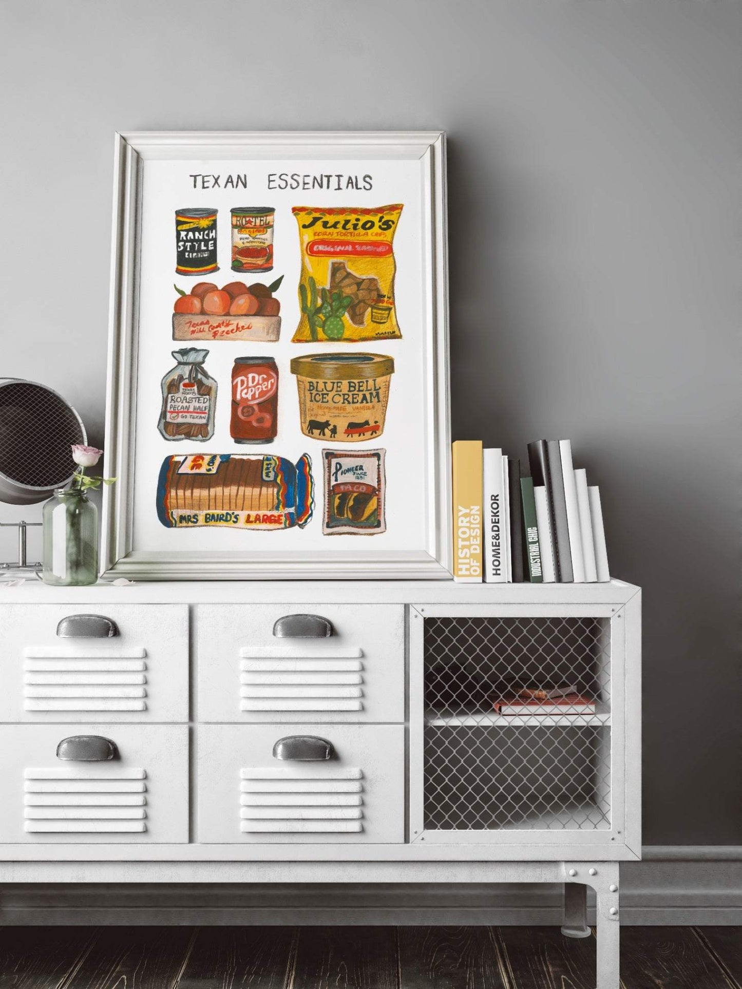 Framed Texas Brand Essentials print by Caya Crum featuring iconic Texas food items on a white dresser in a modern room