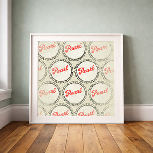 Pearl Beer bottle caps print by Betsy Crum framed upright against a grey-green wall