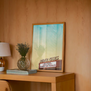 River Oaks Theatre Houston art print by Betsy Crum — framed in a wood-accent room