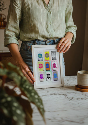 Nine Lone Star Cans bar wall art print by Betsy Crum — neutral frame room mockup