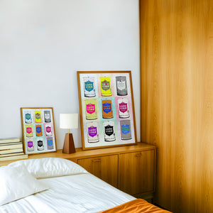 Nine Lone Star Cans bar wall art print by Betsy Crum — framed in a wood-accent room