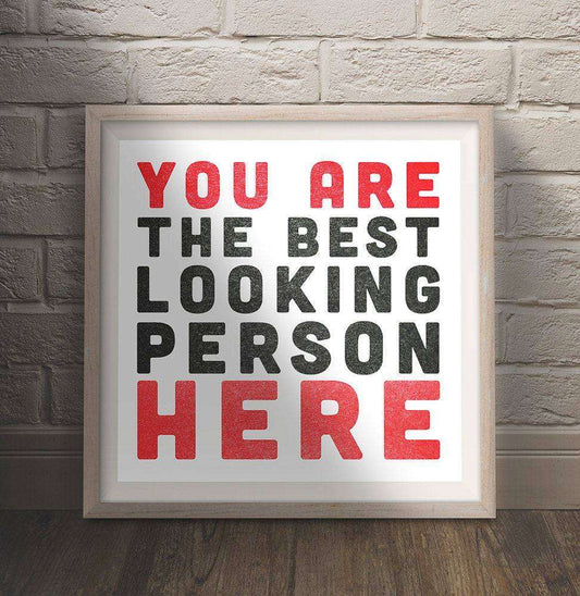 Cool Guy Gift wall art print with bold red and black text saying You Are The Best Looking Person Here by Crum Art