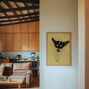 Edie the Rodeo Dog art print by Caya Crum — framed in a wood-accent room