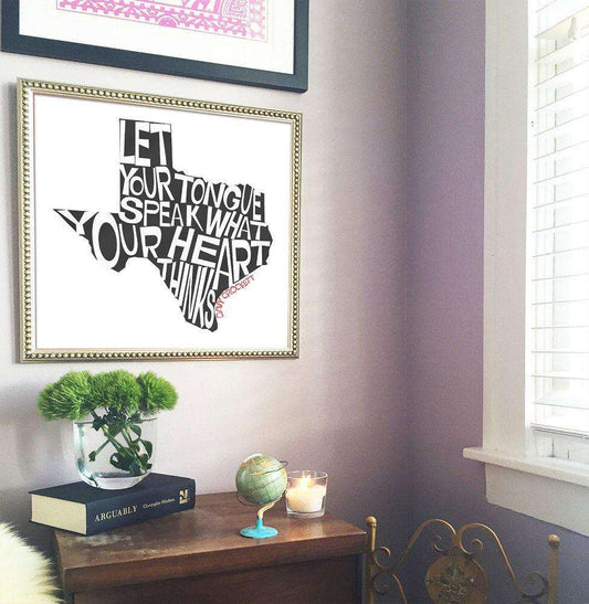 Davy Crockett Texas shaped art print with quote "Let Your Tongue Speak What Your Heart Thinks" by Betsy Crum displayed in framed wall decor.