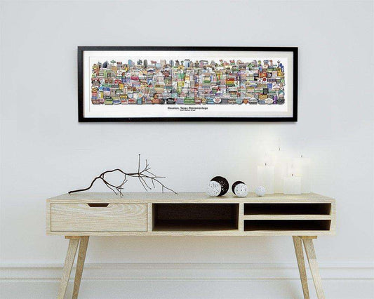 Houston Classics Art Print by Betsy Crum hanging above a minimalist wooden console table with decorative objects