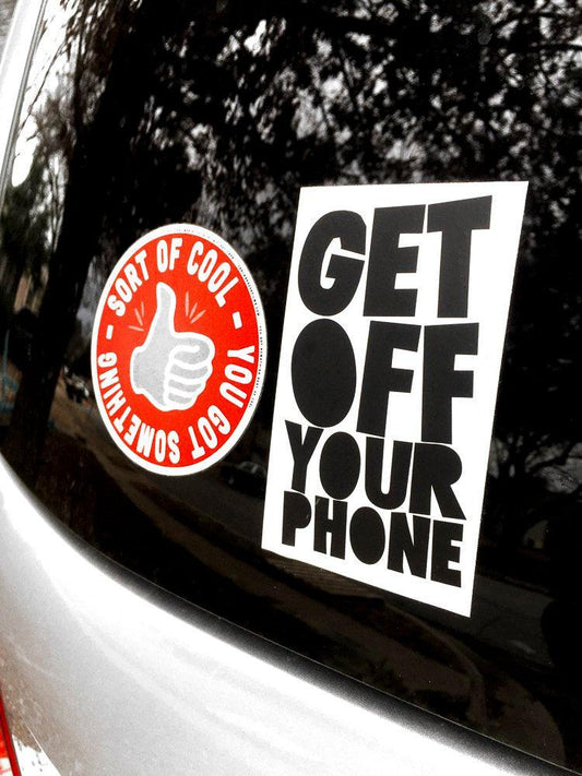 Get off Your Phone bold black text vinyl sticker on car window urging less screen time