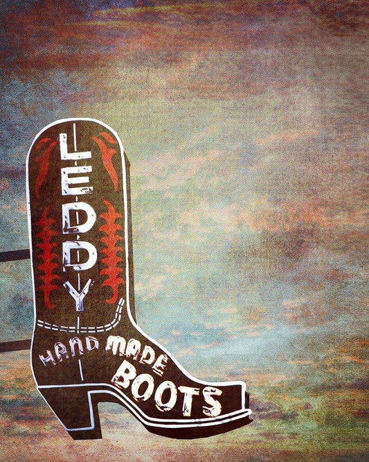 Leddy Handmade Boots vintage-style painted sign shaped like a cowboy boot on textured background