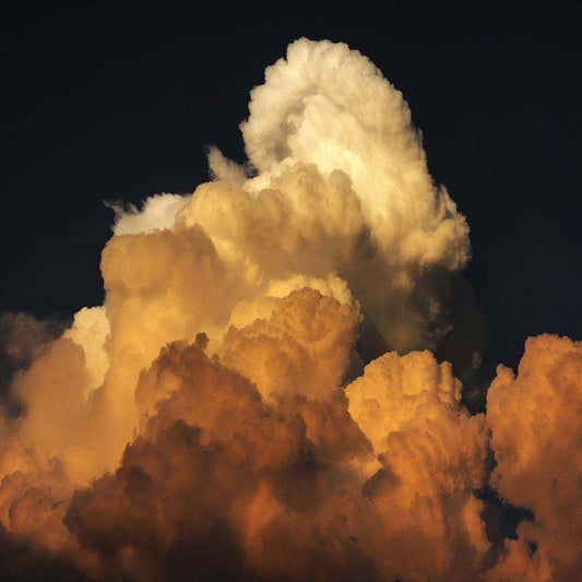 West Texas Clouds art print featuring dramatic textured clouds in warm tones on dark sky background by Betsy Crum