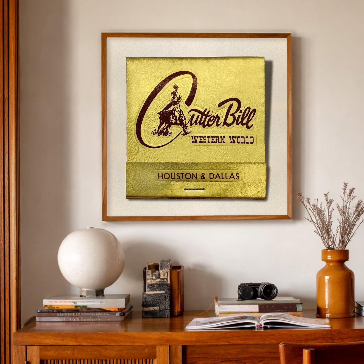 Texas Art Print - Cutter Bill Western World Matchbook Art Print by Crum Art, a matted archival art print in a gold frame inspired by Texas rodeo lore, vintage western ephemera, and the larger-than-life swagger of Rex Cauble. This museum quality print is made right here in Texas.