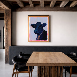 Money Cow pop art print in Western ranch room with wood beams and rustic furniture