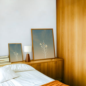 White Sands Yucca desert art print by Betsy Crum — framed in a wood-accent room