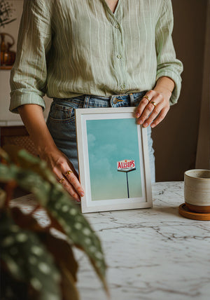 Allsup's Under a Big Sky Texas Art print by Betsy Crum — neutral frame room mockup