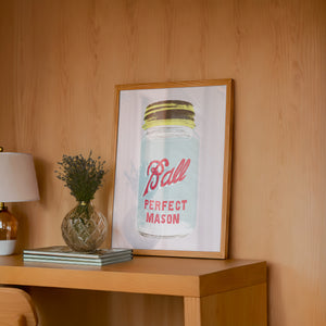 Ball Jar kitchen art print by Betsy Crum — framed in a wood-accent room