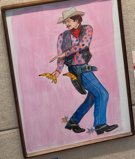 Banana Cowboy, original painting by Caya Crum — framed, a cowboy on pink drawing a banana from his holster (sold)
