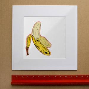 Banana Pop Art Print | Banana Decor | Betsy Crum Art in matted square frame mockup