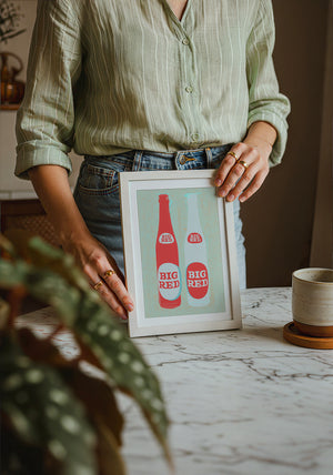 Big Red Two Bottles kitchen print by Betsy Crum — neutral frame room mockup