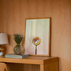 Buc-ee's Under a Big Sky Texas art print by Betsy Crum — framed in a wood-accent room