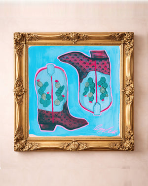 Prickly pear cowboy boots art print by Caya Crum in a square gold frame, blue western art