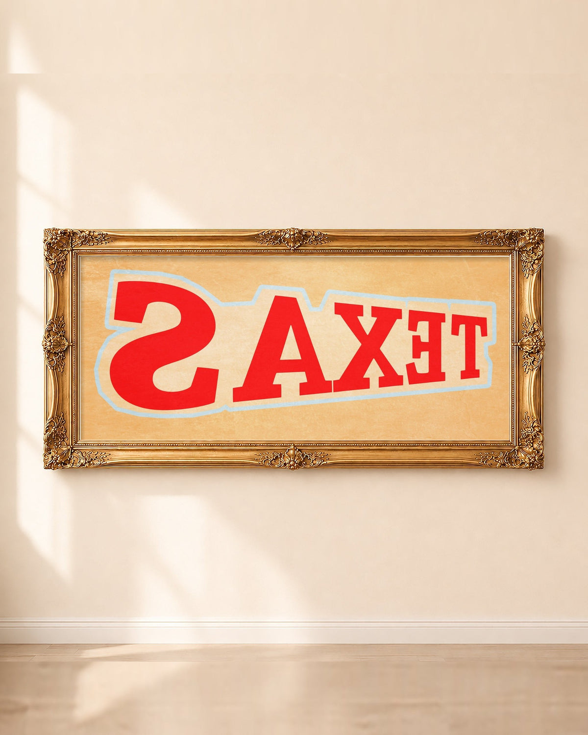 Cool Texas backwards TEXAS panoramic art print by Betsy Crum in a long gold frame on a sunlit wall
