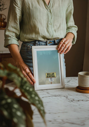 Dollar General Marfa art print by Betsy Crum — neutral frame room mockup