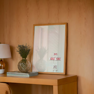 DW's Roadside Sign Oklahoma art print by Betsy Crum — framed in a wood-accent room