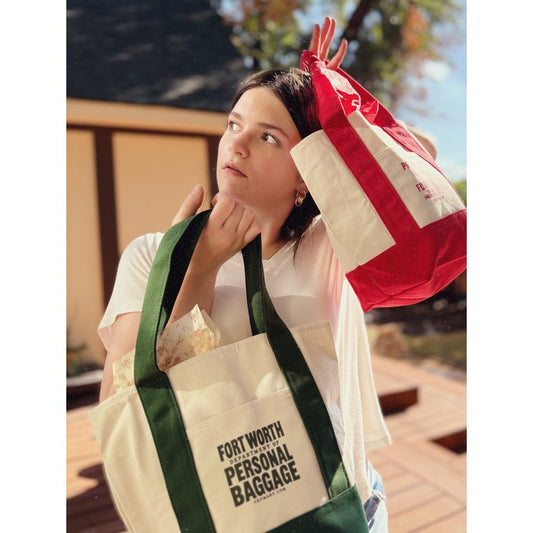 Fort Worth Department of Personal Baggage green canvas boat tote by Crum Art, with the red Property of the City of Fort Worth tote