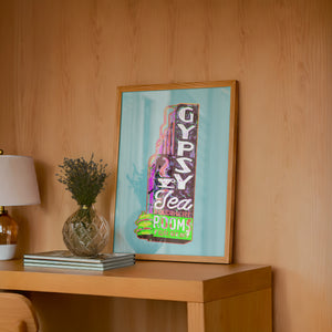 Gypsy Tea Room Dallas art print by Betsy Crum — framed in a wood-accent room