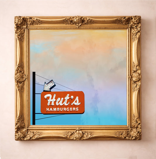 Hut's Hamburgers Austin sky print by Betsy Crum in a square gold frame