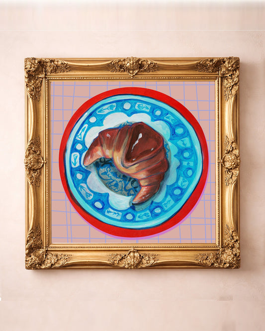 Croissant on a Chinoiserie Plate art print in a square gold frame by Caya Crum