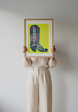 Leddy Boot Yellow cowboy boot art print by Betsy Crum — framed with velvet mat
