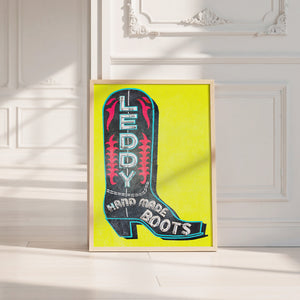 Leddy Boot Yellow cowboy boot art print by Betsy Crum — neutral frame room mockup